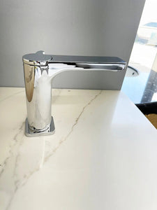 Moon faucet left side view. Spout reach 6 inches from the center.